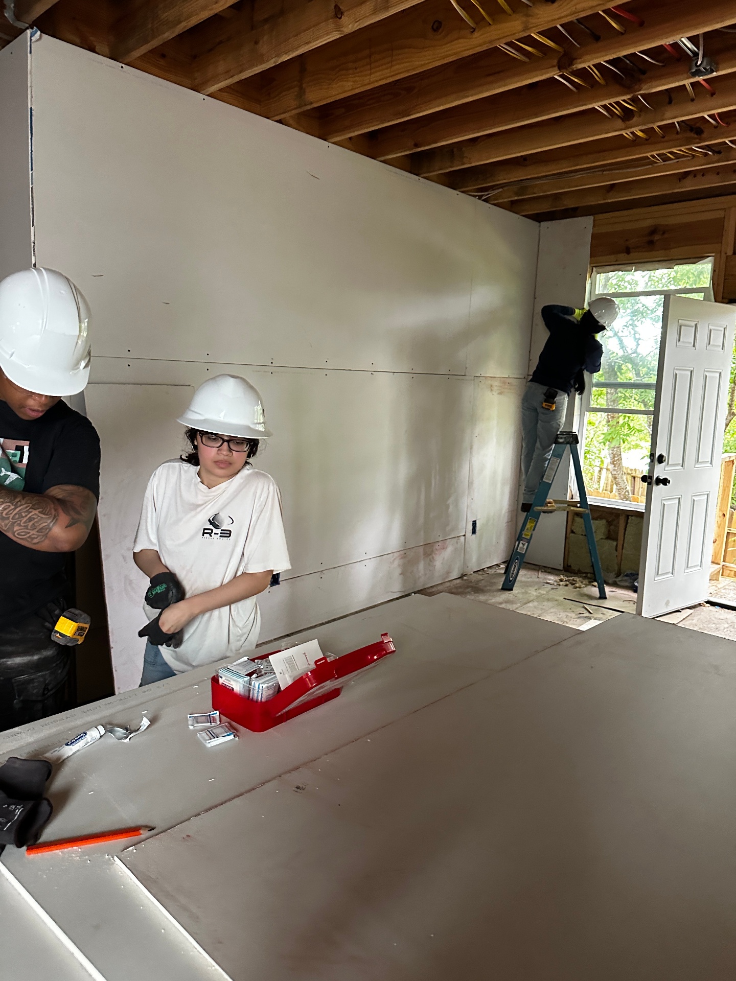 Drywall crew working on a BEDDIEO interior